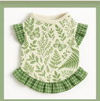 Cute ruffled pet dress with floral meadow print in green and beige.